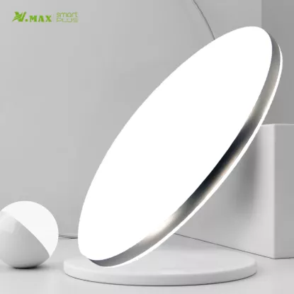 Minimalist round LED light displayed on white stand for product showcase