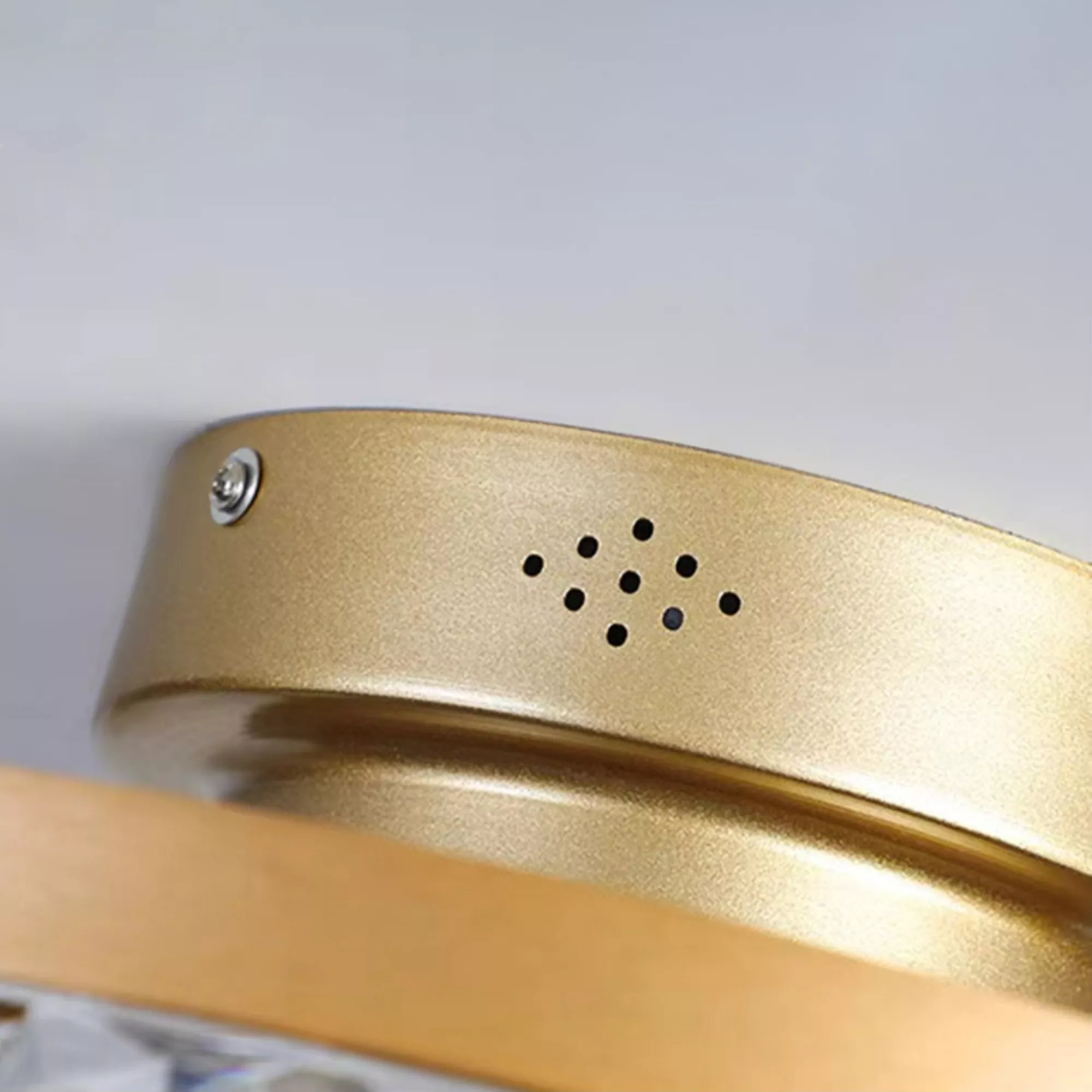 Close-up of gold fan body with ventilation design