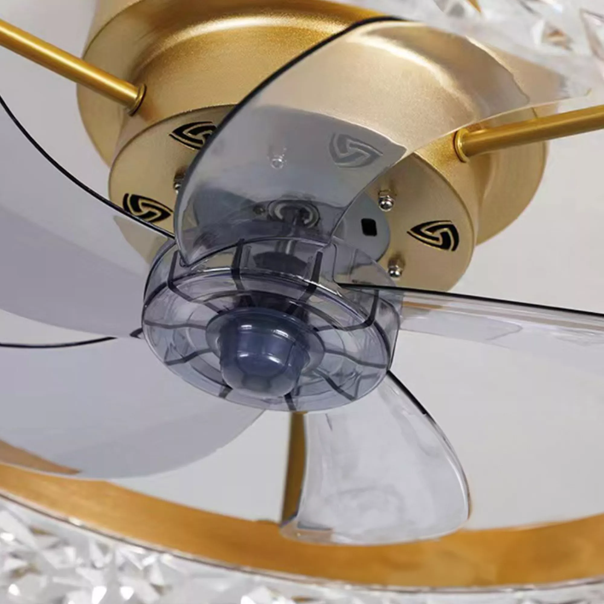 Detailed view of transparent retractable fan blades and motor hub