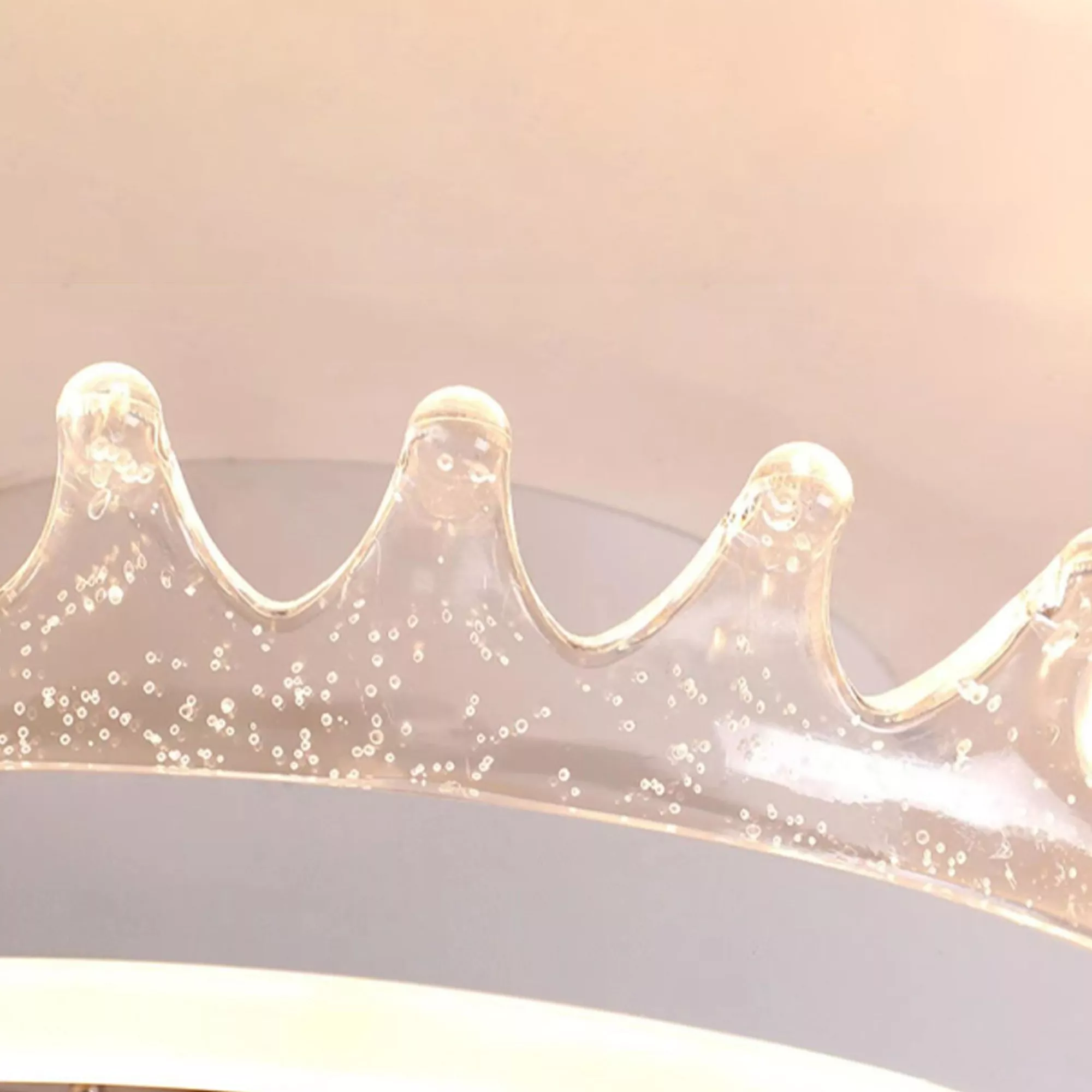 Detailed view of bubble-effect acrylic crystal crown edge on fan light