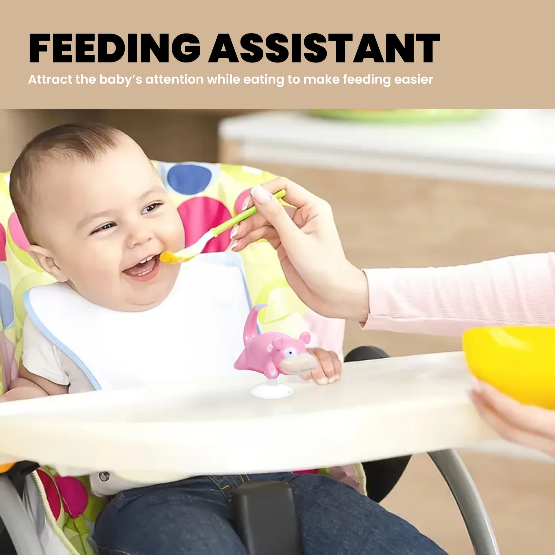 Cute pink cartoon character toy used as feeding assistant on baby high chair, designed to attract baby attention during mealtime.