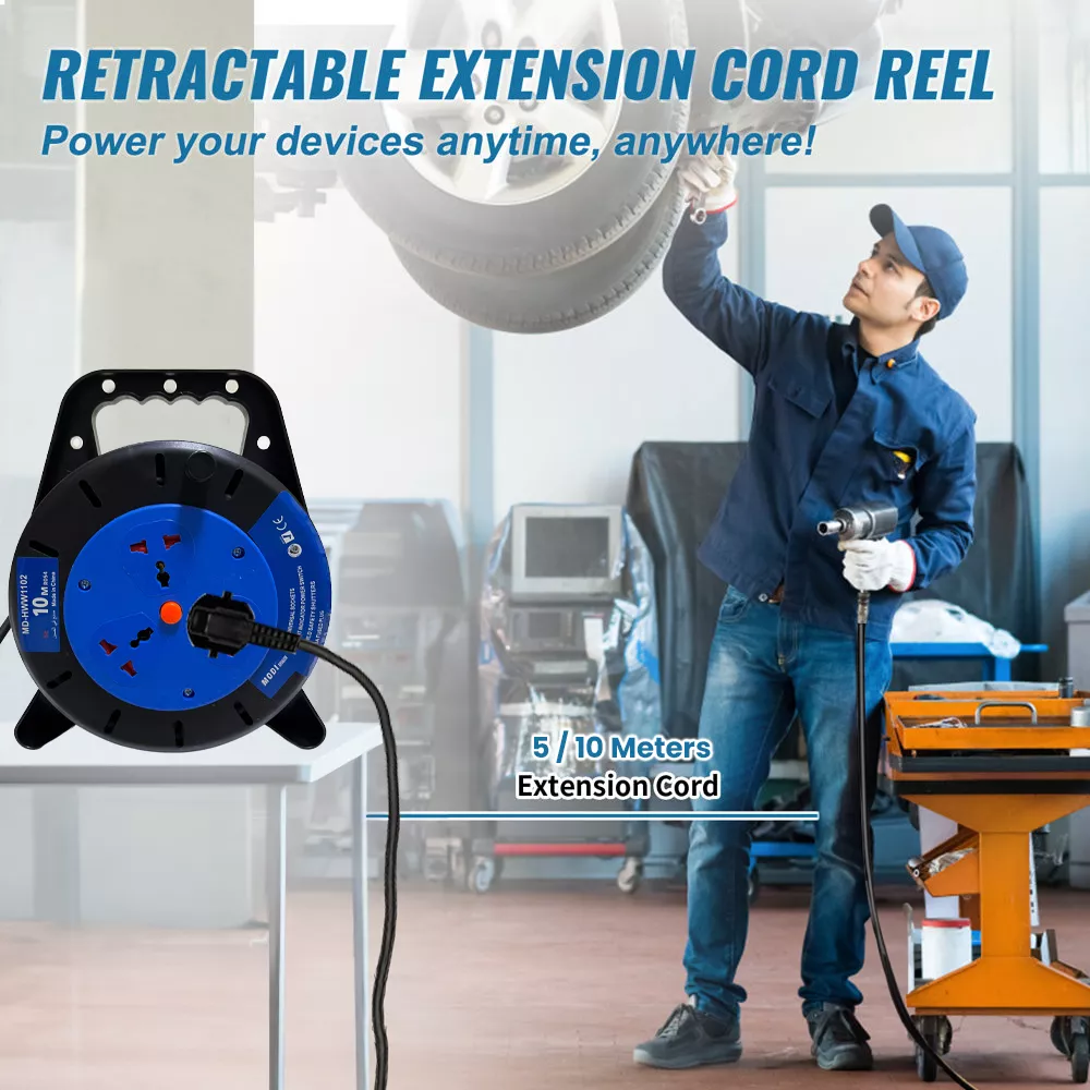 Retractable extension cord reel powering tools in workshop, portable cable reel extension socket for professional use.