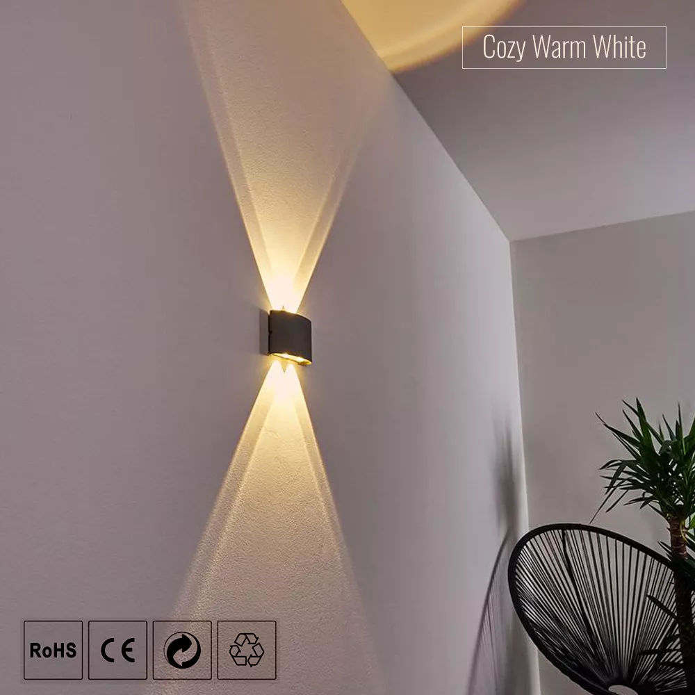 Modern black LED wall sconce with 12cm width and 9.5cm height displaying up and down illumination