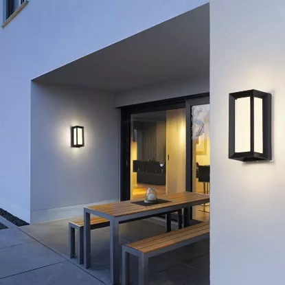 Modern outdoor LED wall light installed on villa exterior wall with warm white illumination