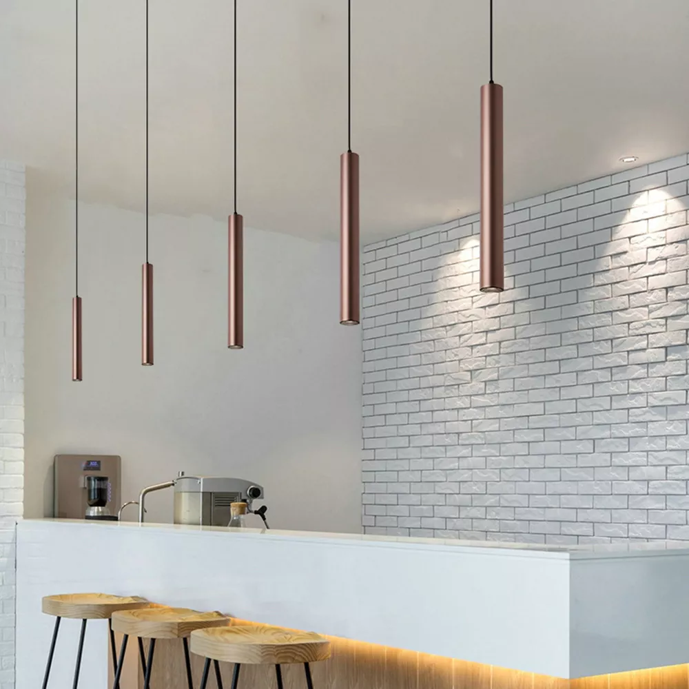 Modern aluminum pendant chandelier with soft warm LED glow, decorative hanging light for contemporary bedroom and hotel interior design.