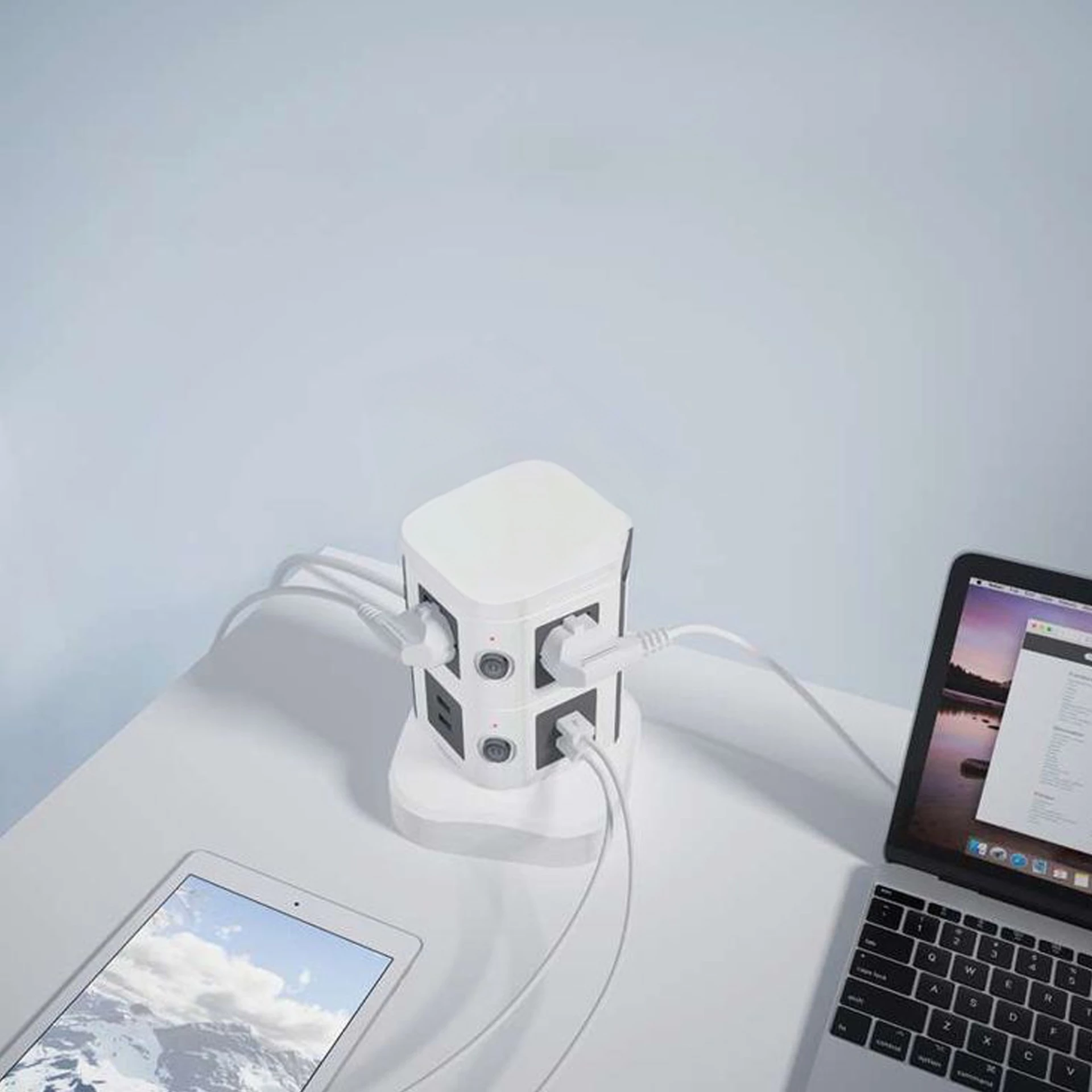Tower extension socket charging multiple electronics including laptop and tablet