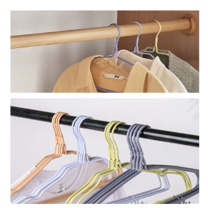 Close-up of lavender steel wire hanger coated in rubber for added grip and garment protection.