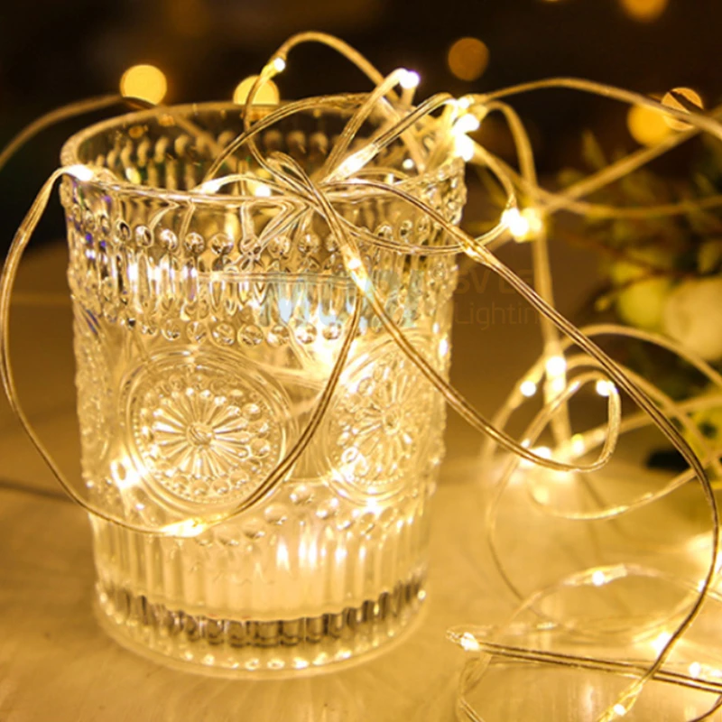 Coiled LED fairy string lights with warm yellow glow used for decorative display
